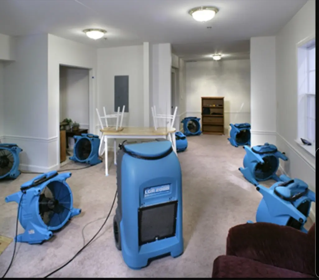 Air movers and dehumidifier setup for Water Damage Restoration in Dalton